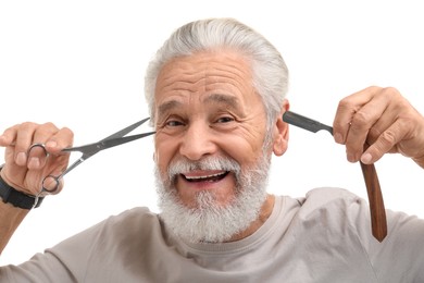 Photo of Bearded senior man holding blade and scissors on white background