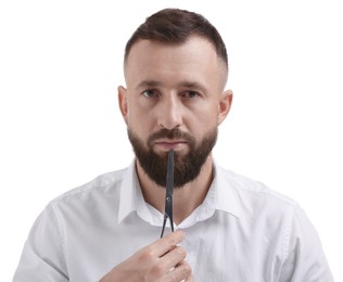 Photo of Bearded man holding scissors on white background