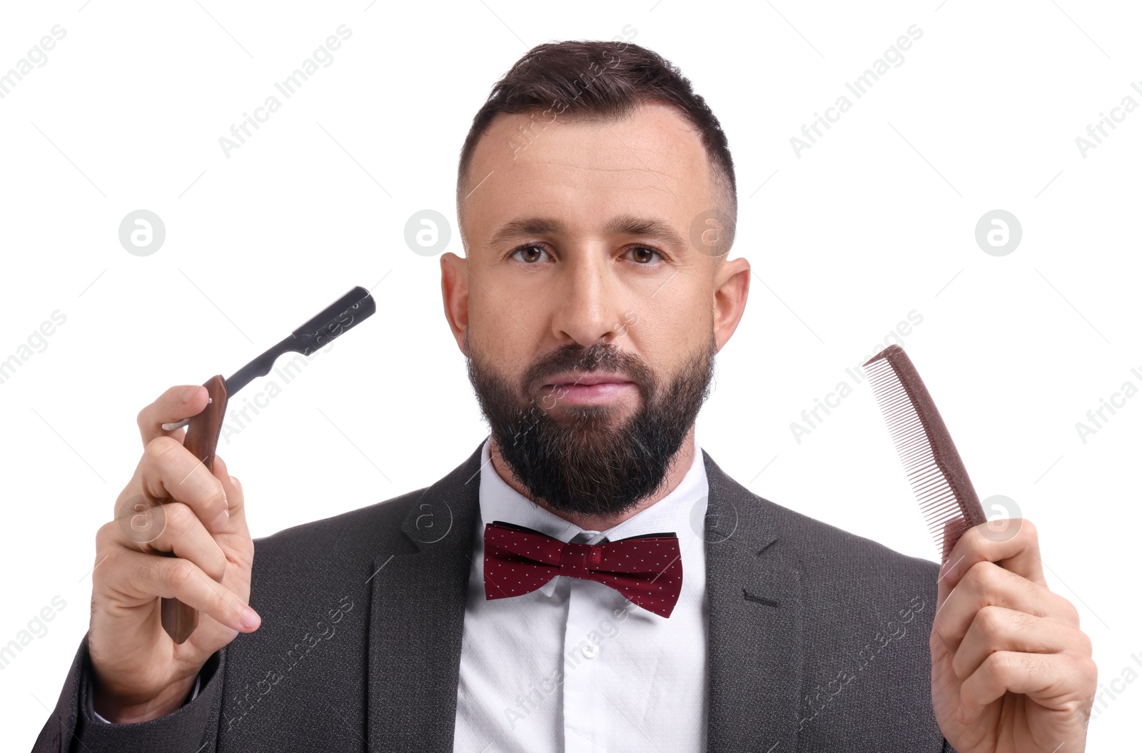 Photo of Bearded man holding blade and scissors on white background