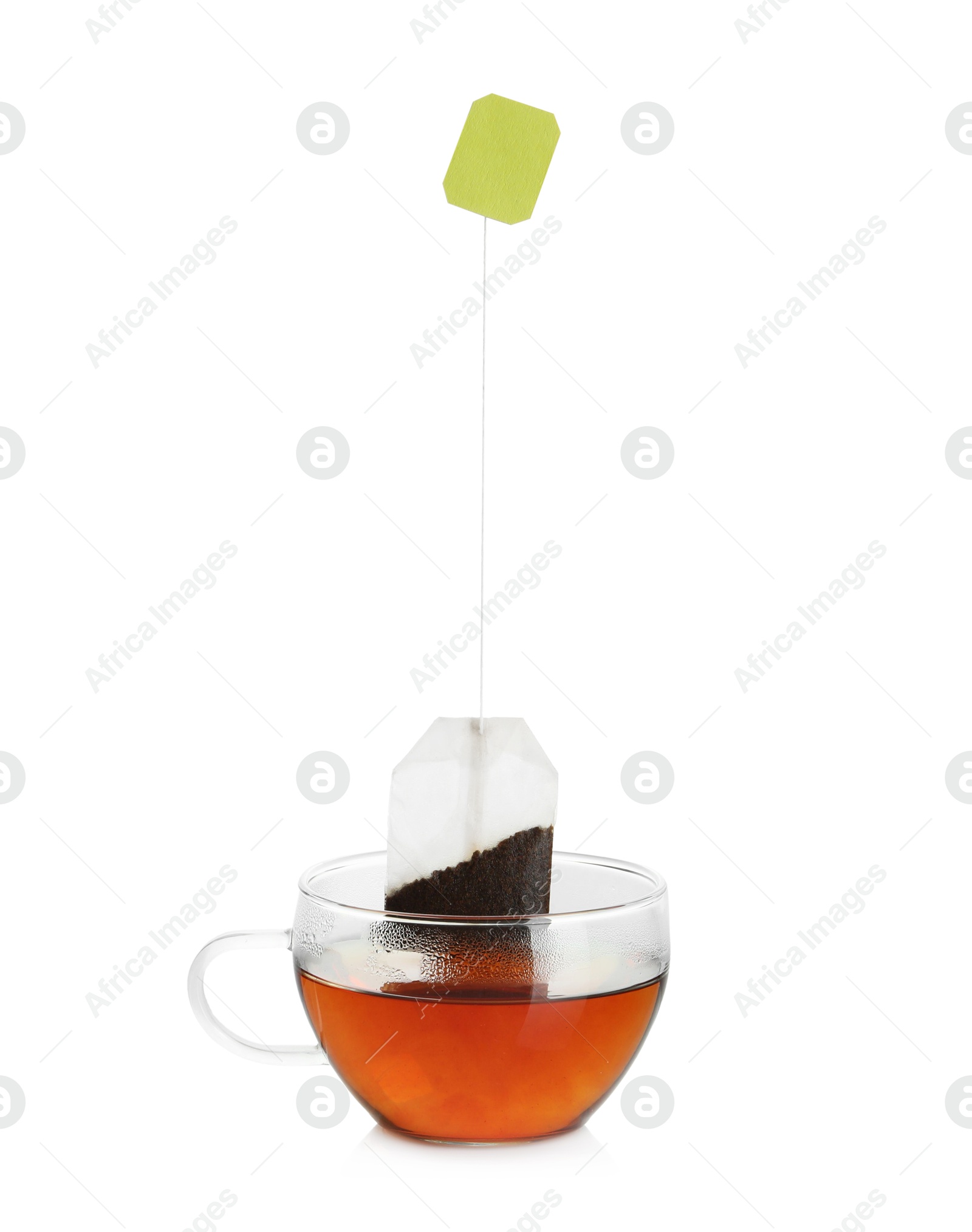 Photo of Cup with tea bag isolated on white