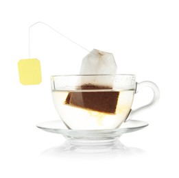 Photo of Brewing aromatic tea. Cup with teabag isolated on white