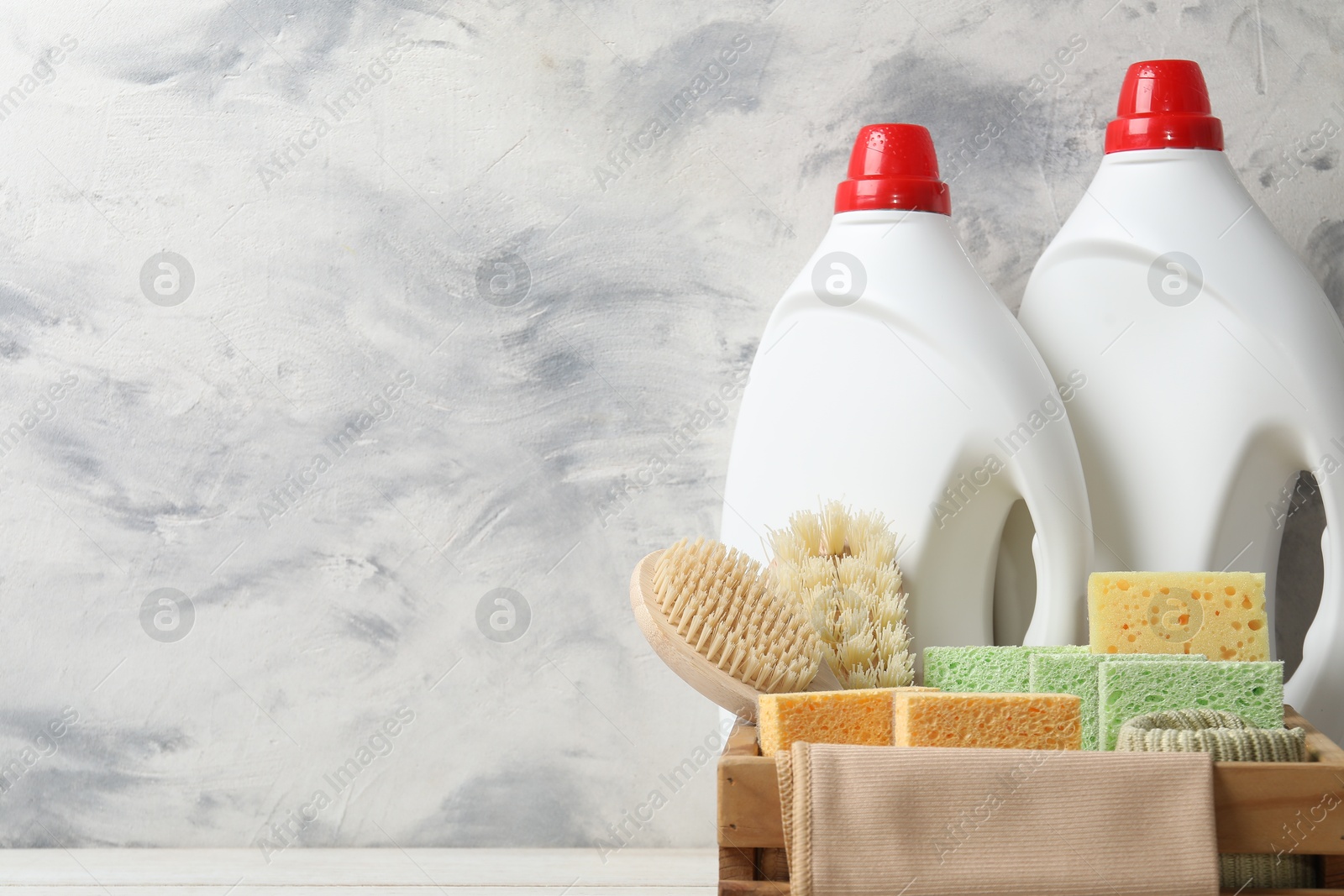 Photo of Eco-friendly cleaning products and supplies on table, space for text