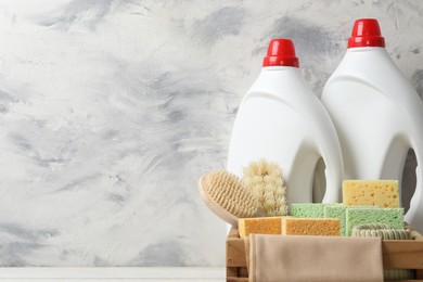 Photo of Eco-friendly cleaning products and supplies on table, space for text