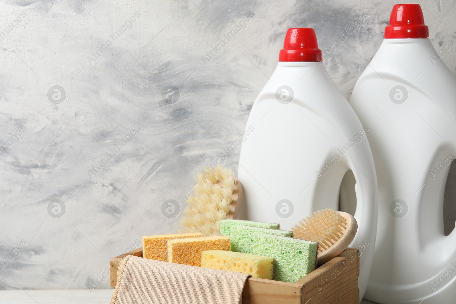 Photo of Eco-friendly cleaning products and supplies on table, space for text