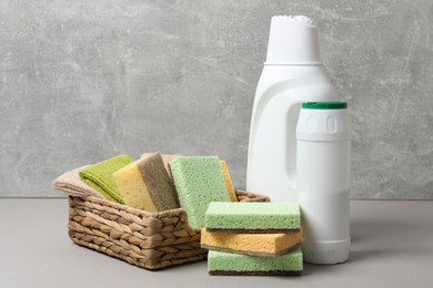 Photo of Eco-friendly cleaning products and supplies on grey table