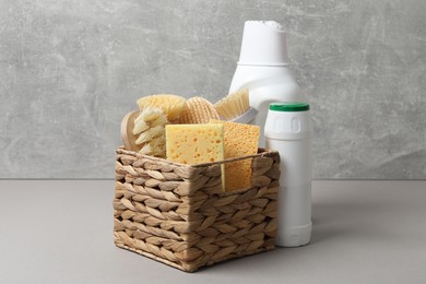 Photo of Eco-friendly cleaning products and supplies on grey table