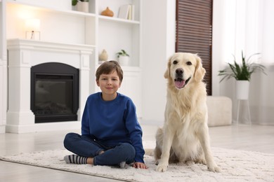 Photo of Boy with his cute dog at home