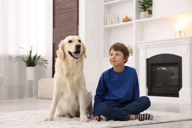 Photo of Boy with his cute dog at home