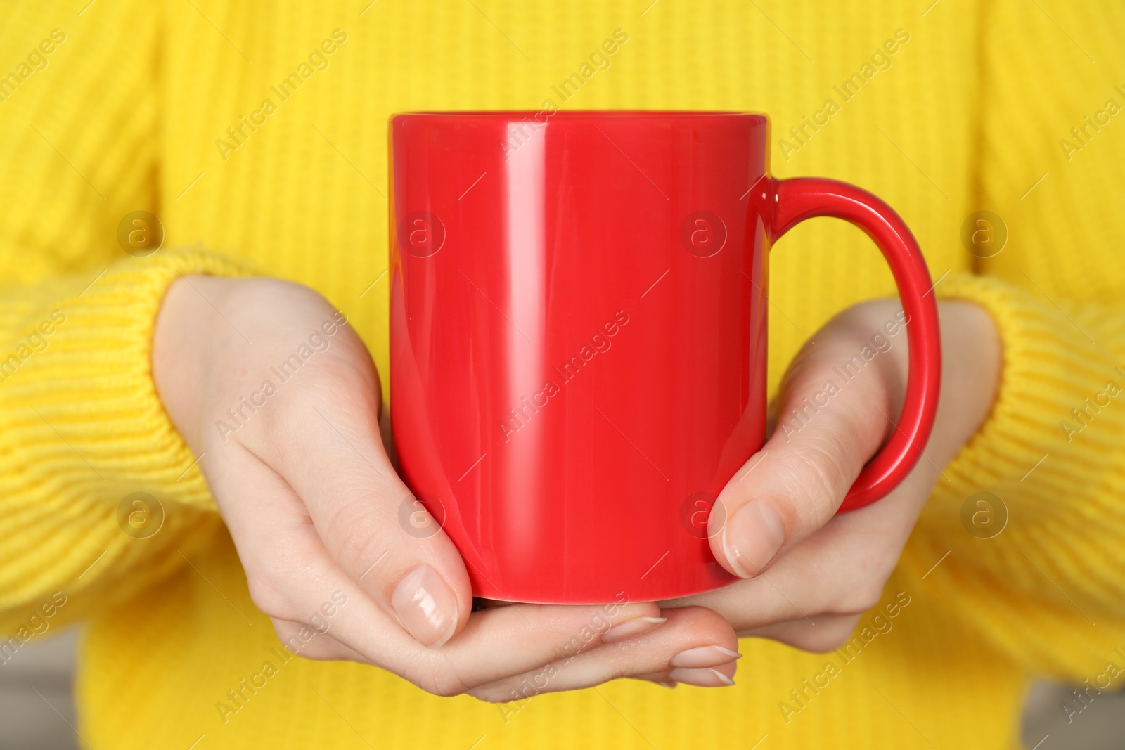 Photo of Woman with red ceramic cup, closeup. Mockup for design