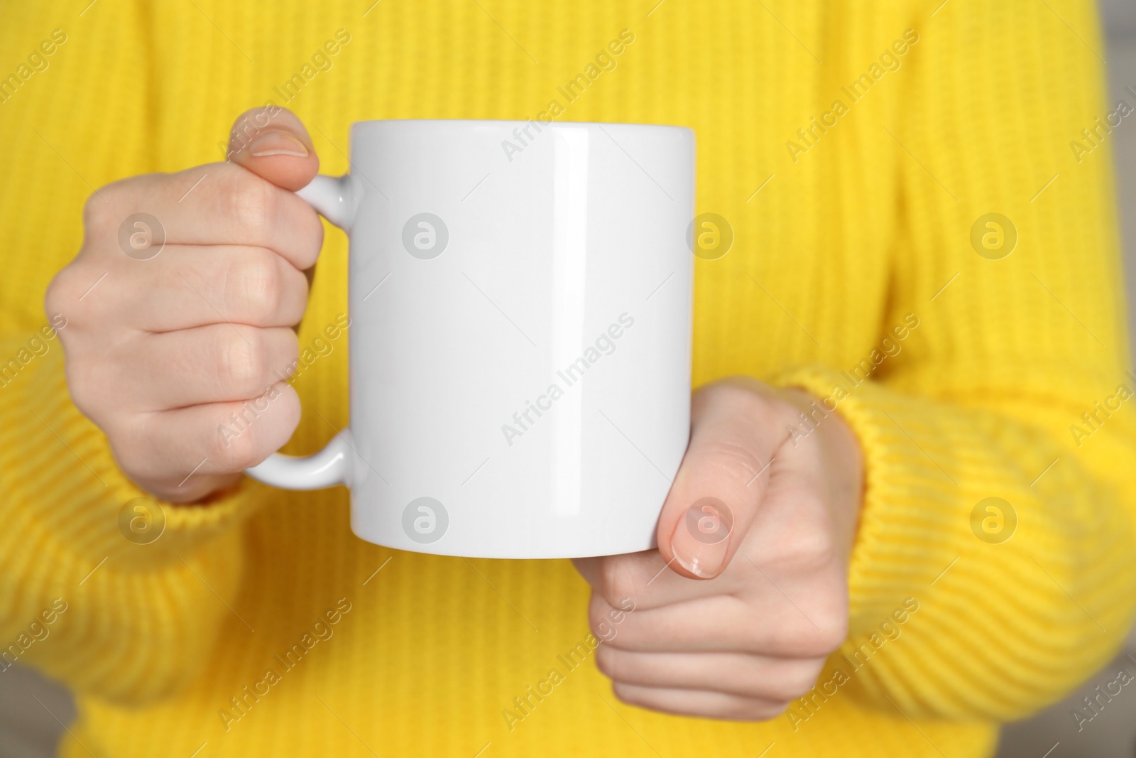 Photo of Woman with white ceramic cup, closeup. Mockup for design