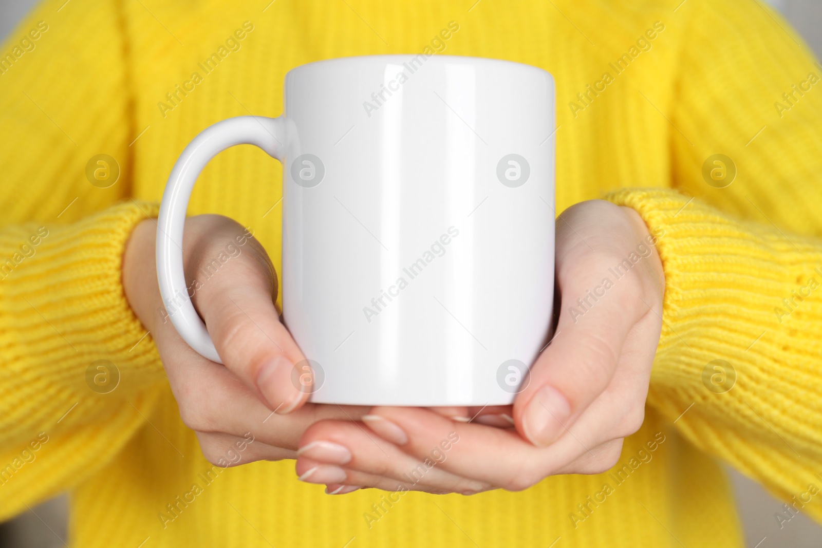 Photo of Woman with white ceramic cup, closeup. Mockup for design