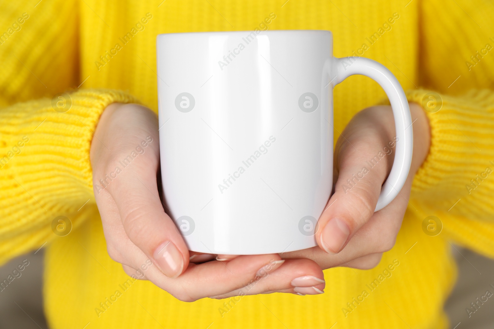 Photo of Woman with white ceramic cup, closeup. Mockup for design