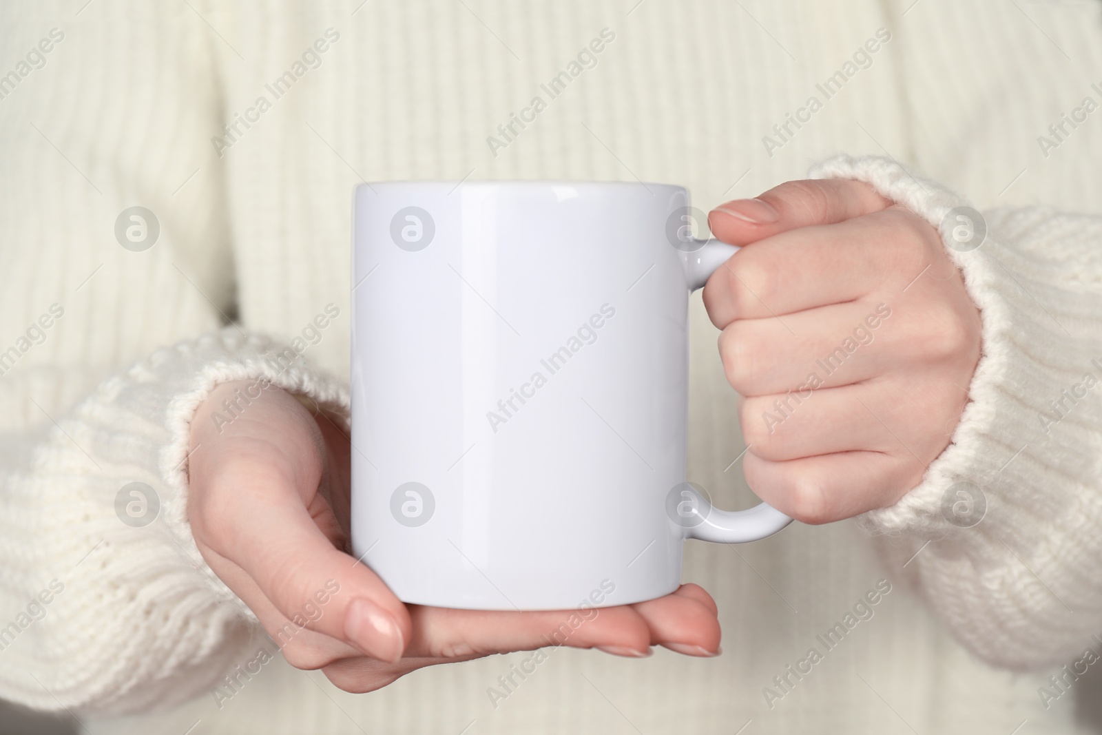 Photo of Woman with white ceramic cup, closeup. Mockup for design