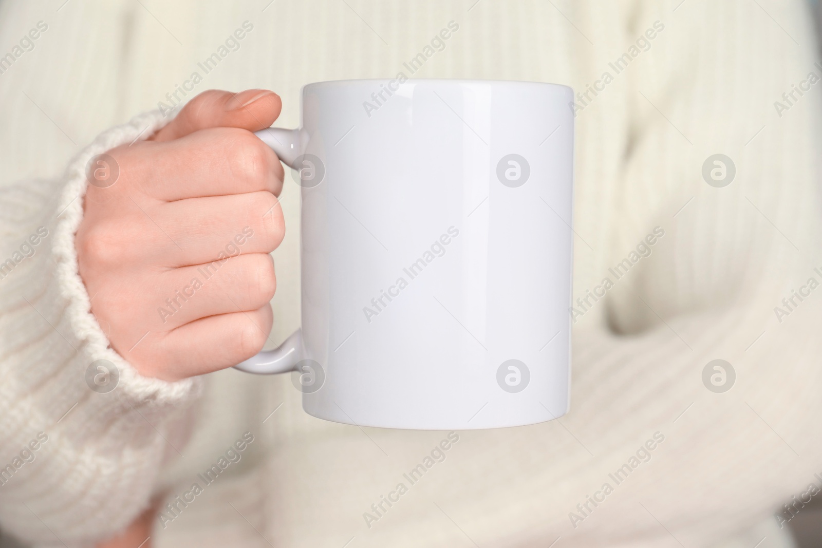 Photo of Woman with white ceramic cup, closeup. Mockup for design