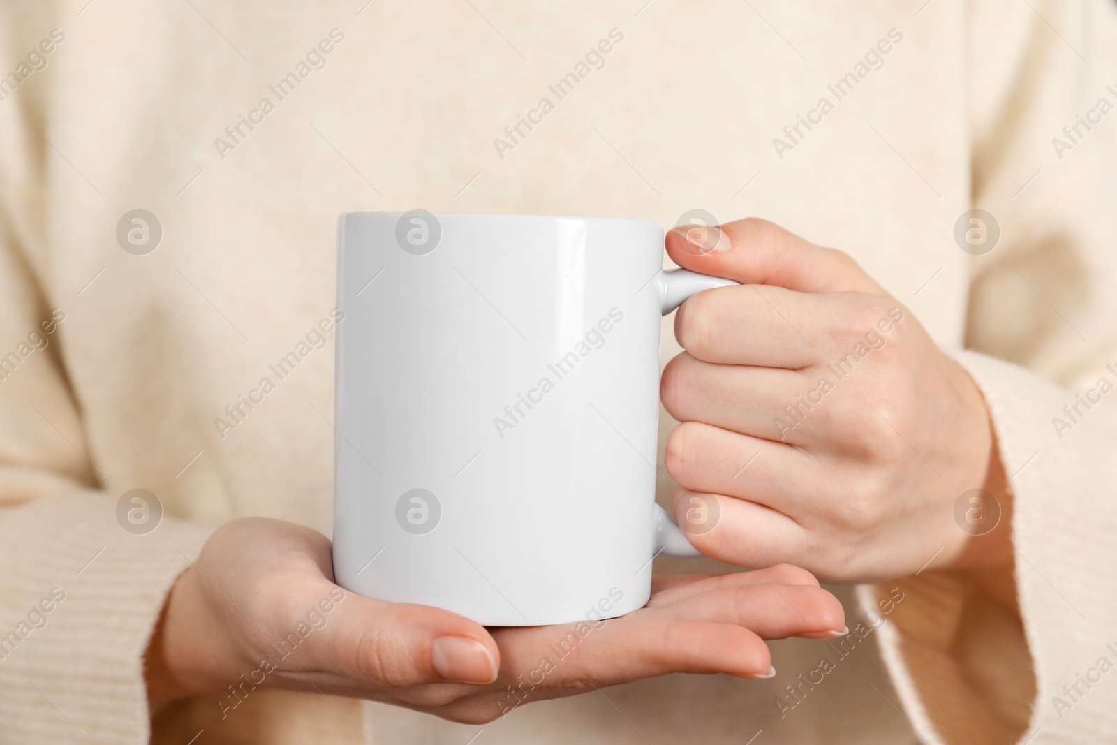 Photo of Woman with white ceramic cup, closeup. Mockup for design