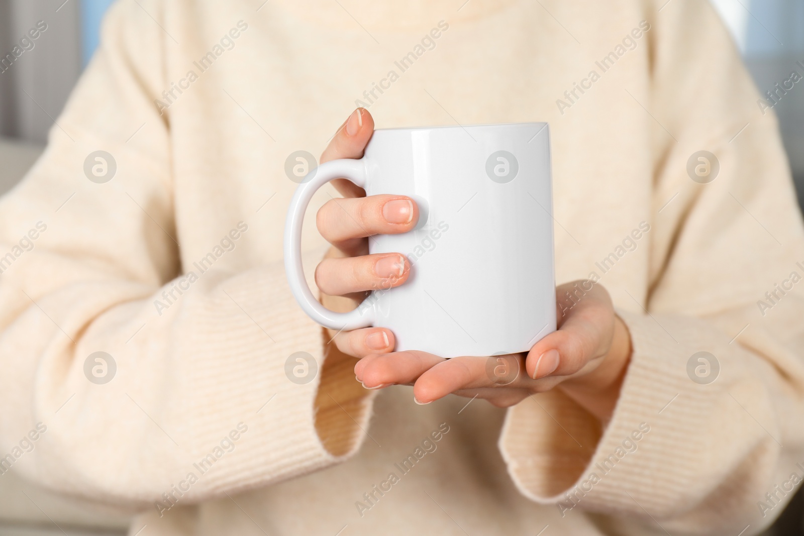 Photo of Woman with white ceramic cup, closeup. Mockup for design