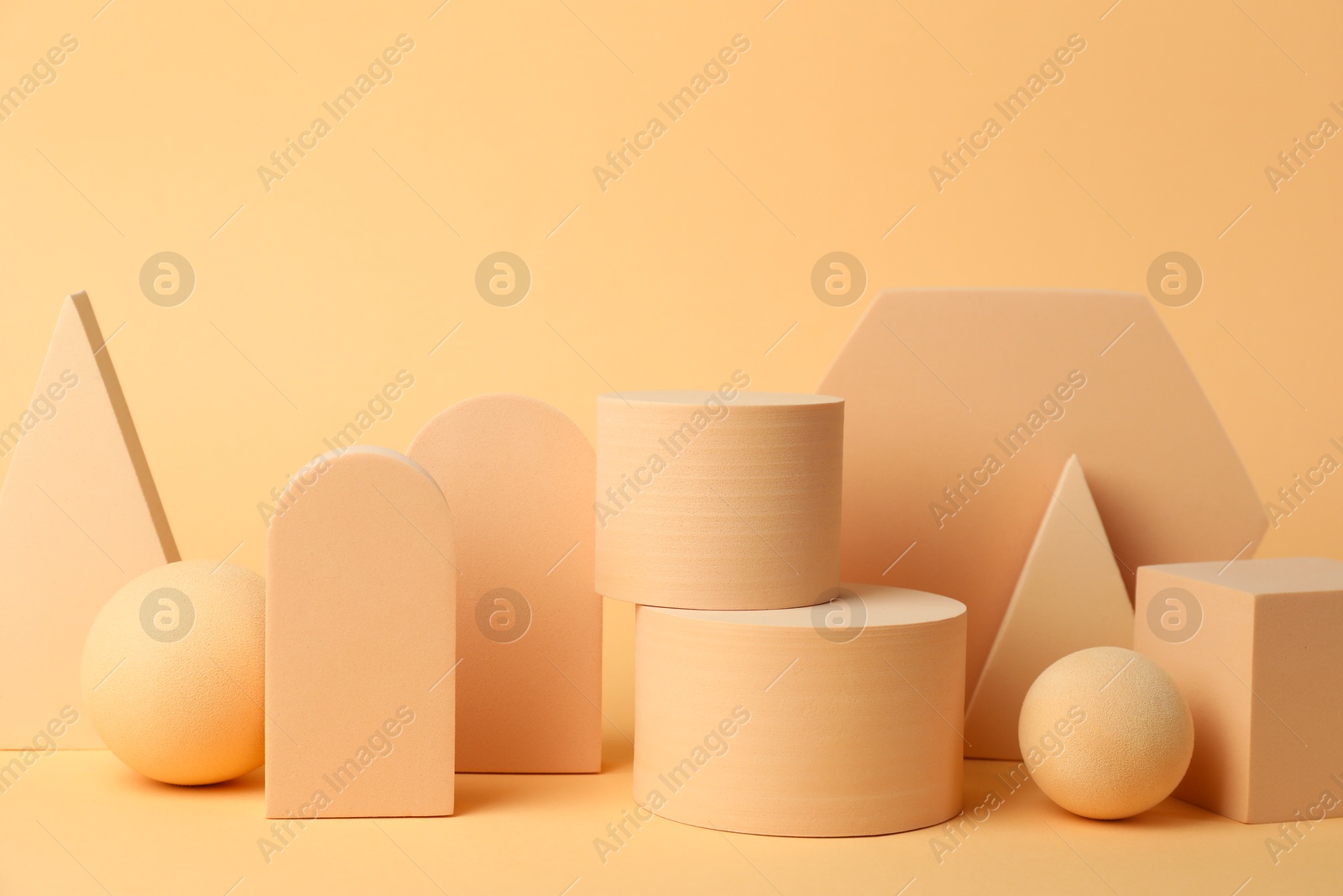 Photo of Presentation of product. Different podiums on beige background