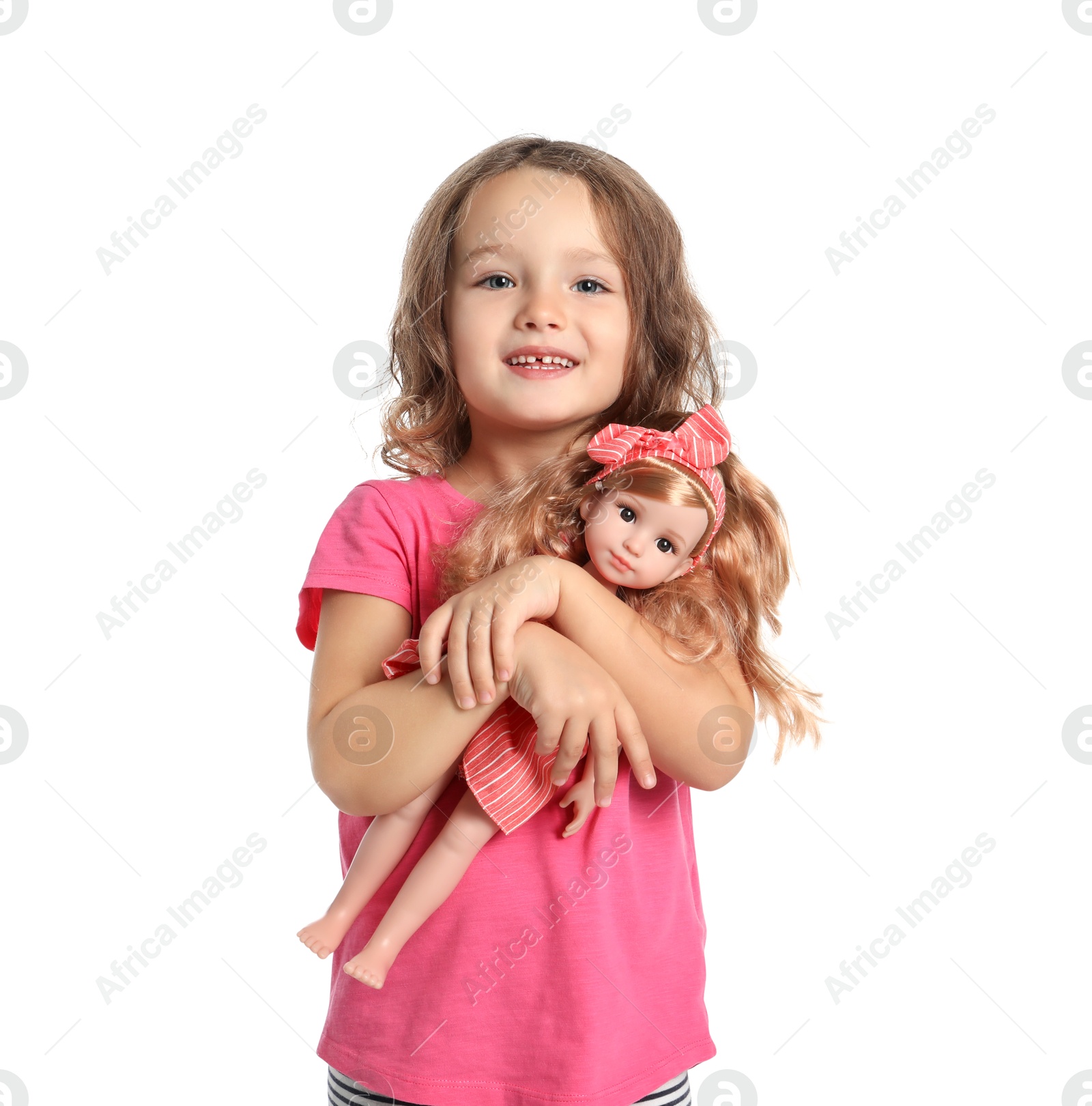 Photo of Cute little girl holding doll on white background