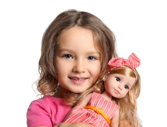 Photo of Cute little girl holding doll on white background