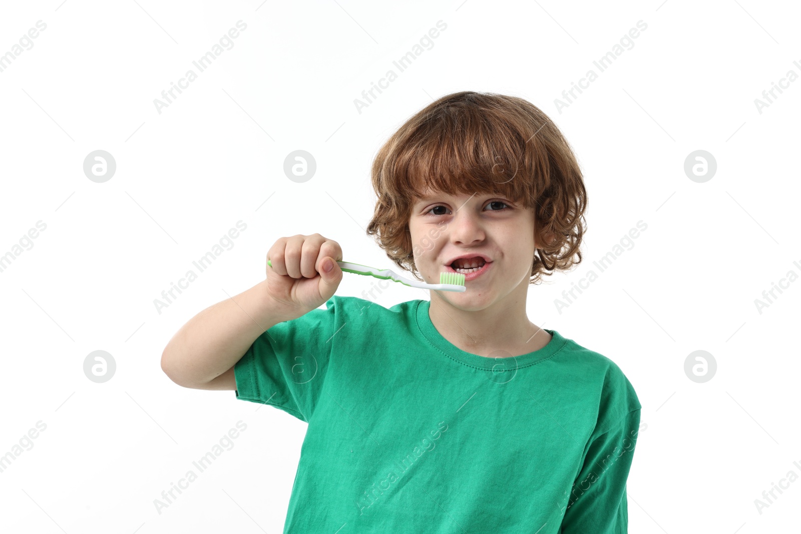 Photo of Cute boy brushing his teeth on white background