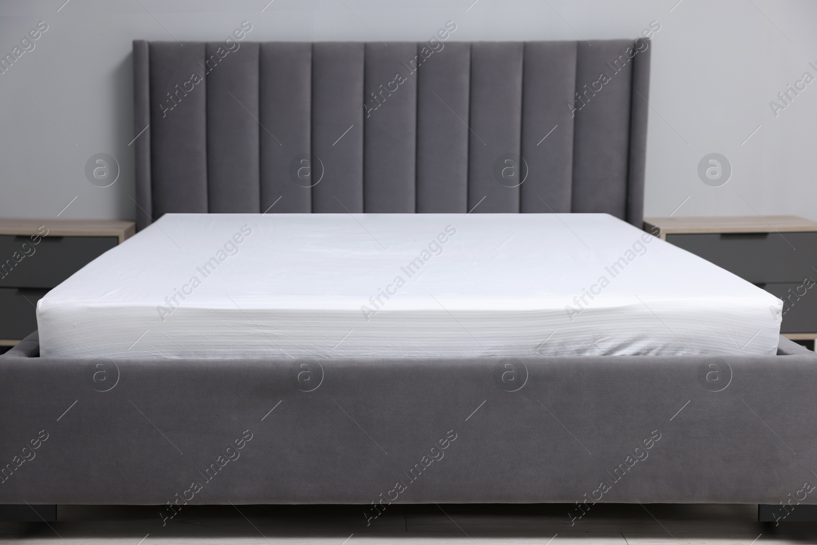 Photo of Comfortable bed with clean linens at home