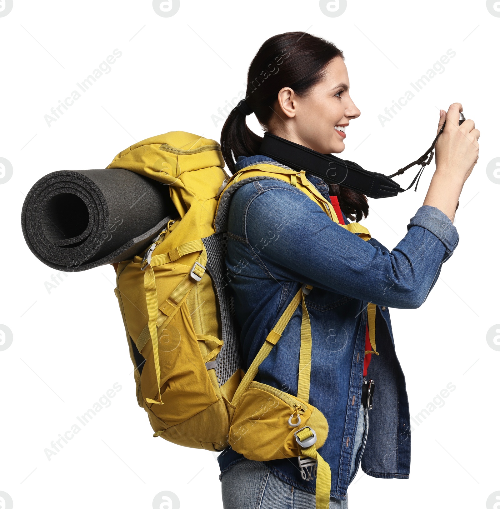 Photo of Young tourist with camera and backpack on white background