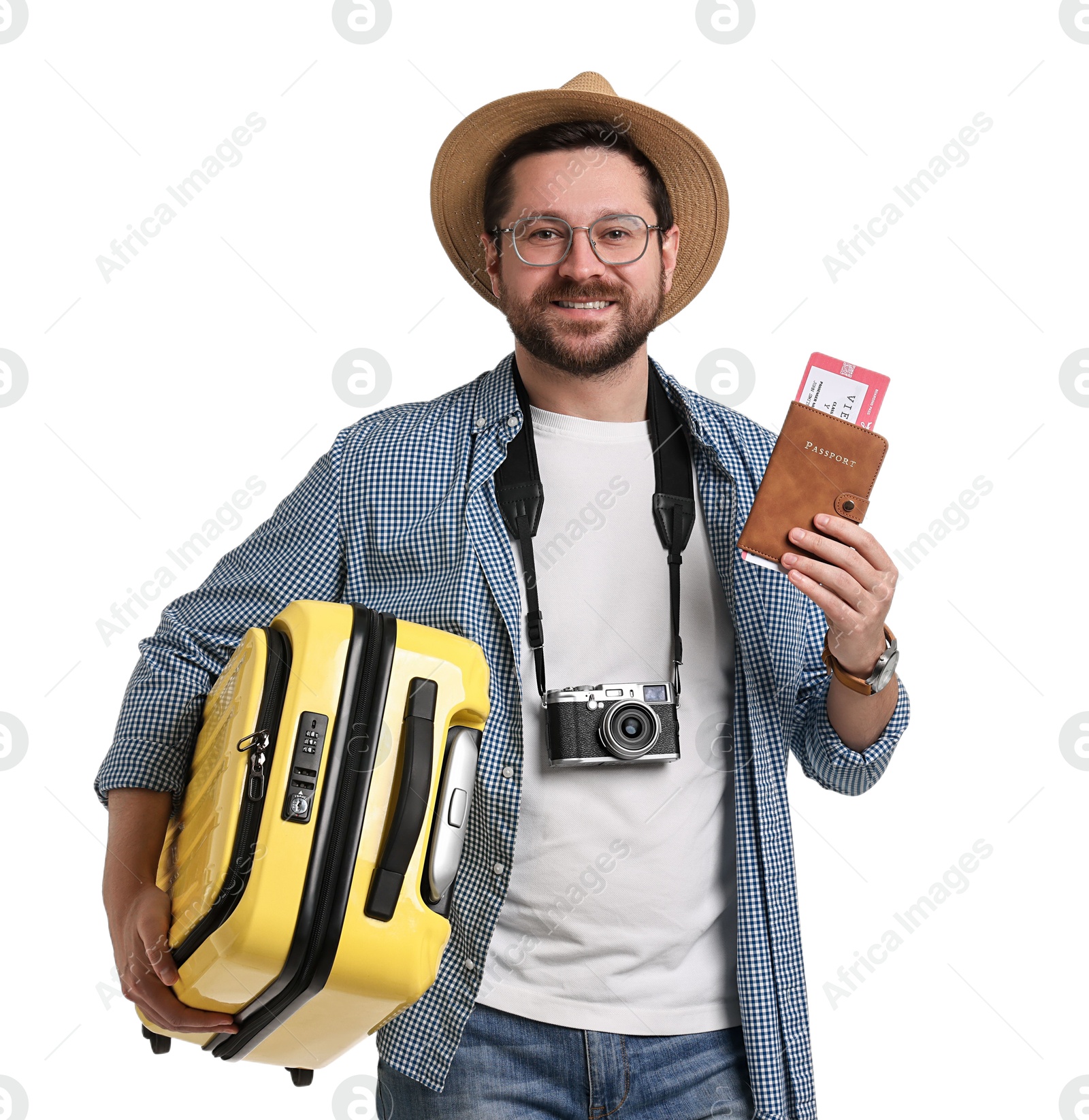 Photo of Happy tourist in hat with suitcase, passport and ticket on white background