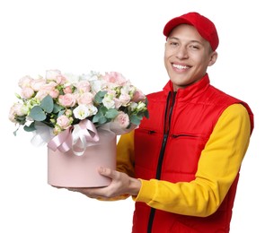 Photo of Smiling delivery man holding gift box with beautiful floral composition on white background