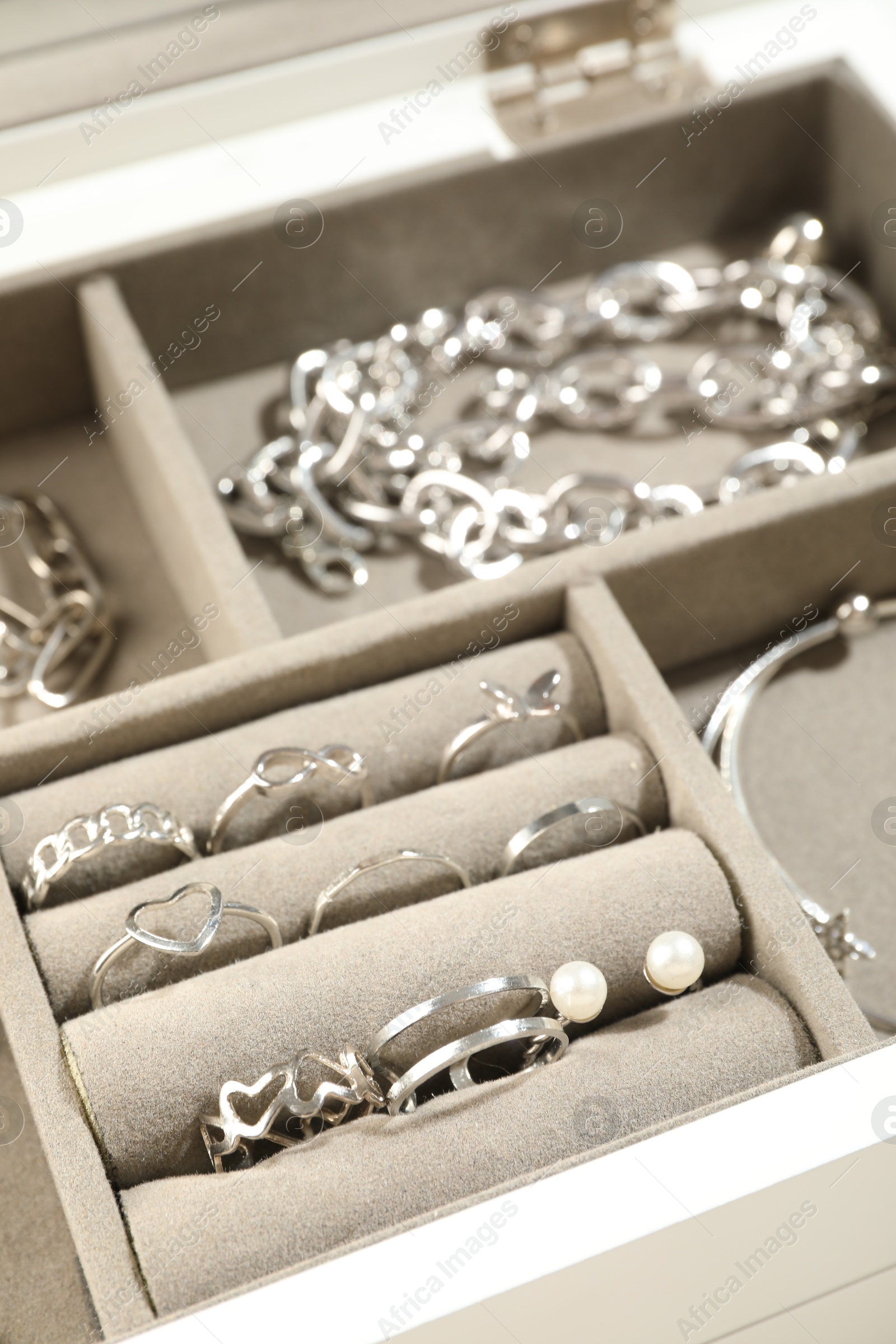 Photo of Many beautiful accessories in jewelry box, closeup