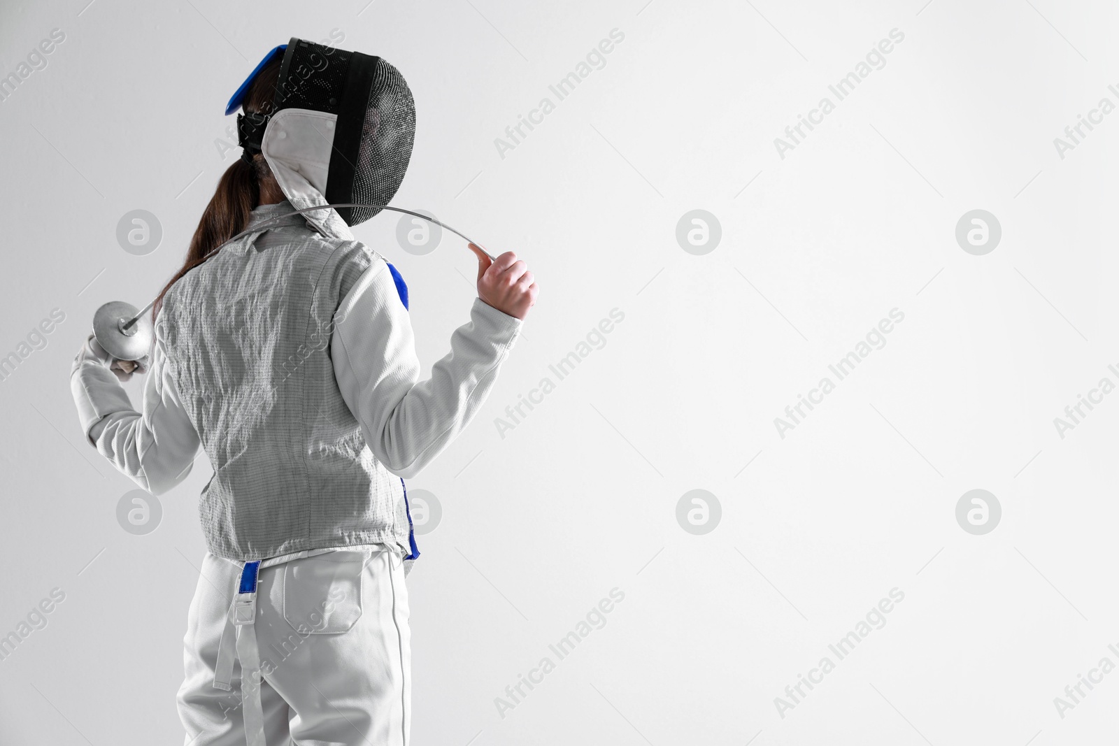 Photo of Fencer with epee on white background, space for text