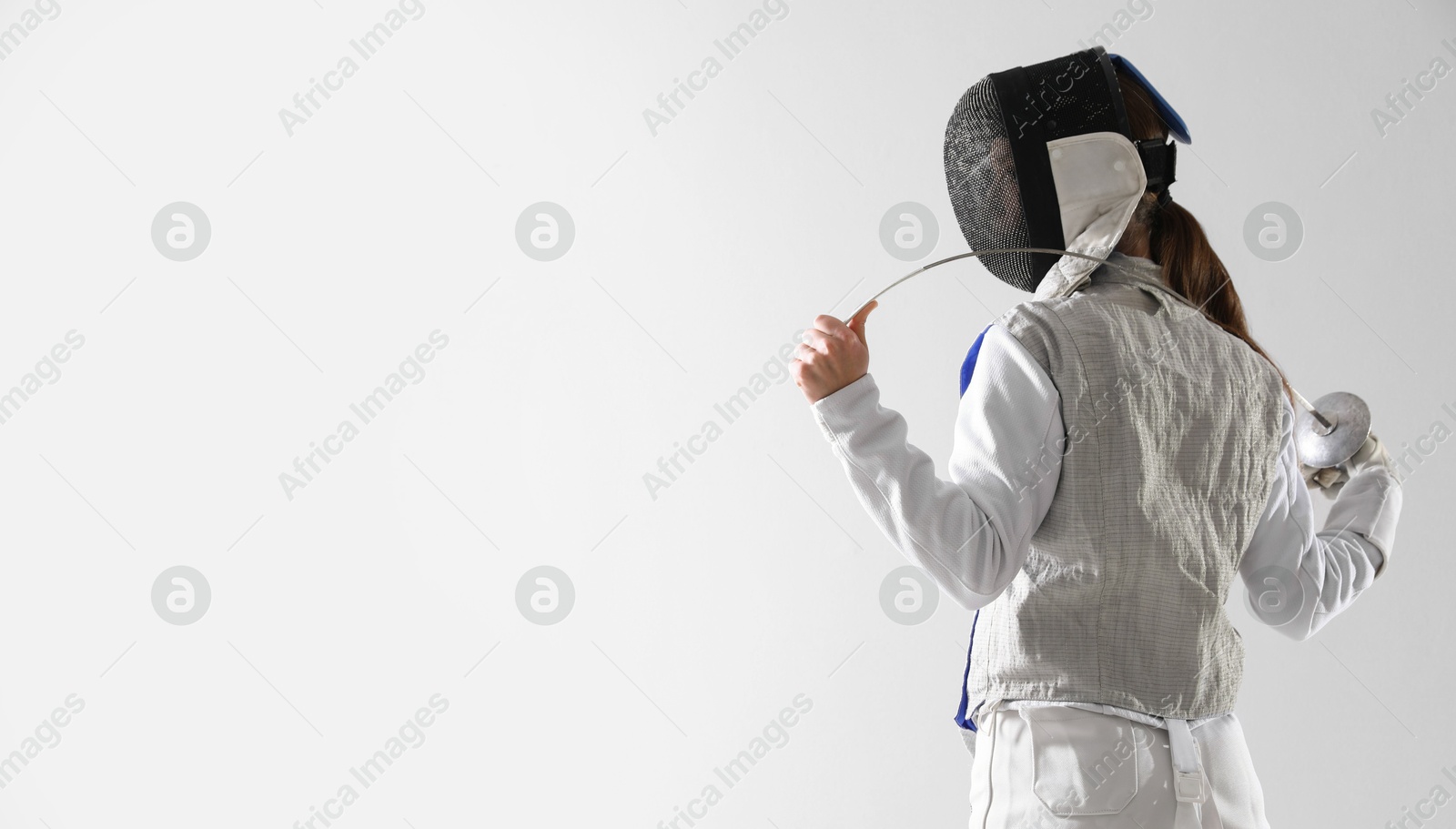 Photo of Fencer with epee on white background, space for text