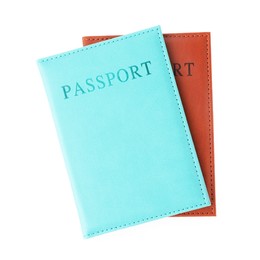 Photo of Passports in bright covers isolated on white, top view