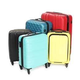 Photo of Many closed colorful suitcases isolated on white