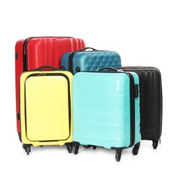 Photo of Many closed colorful suitcases isolated on white