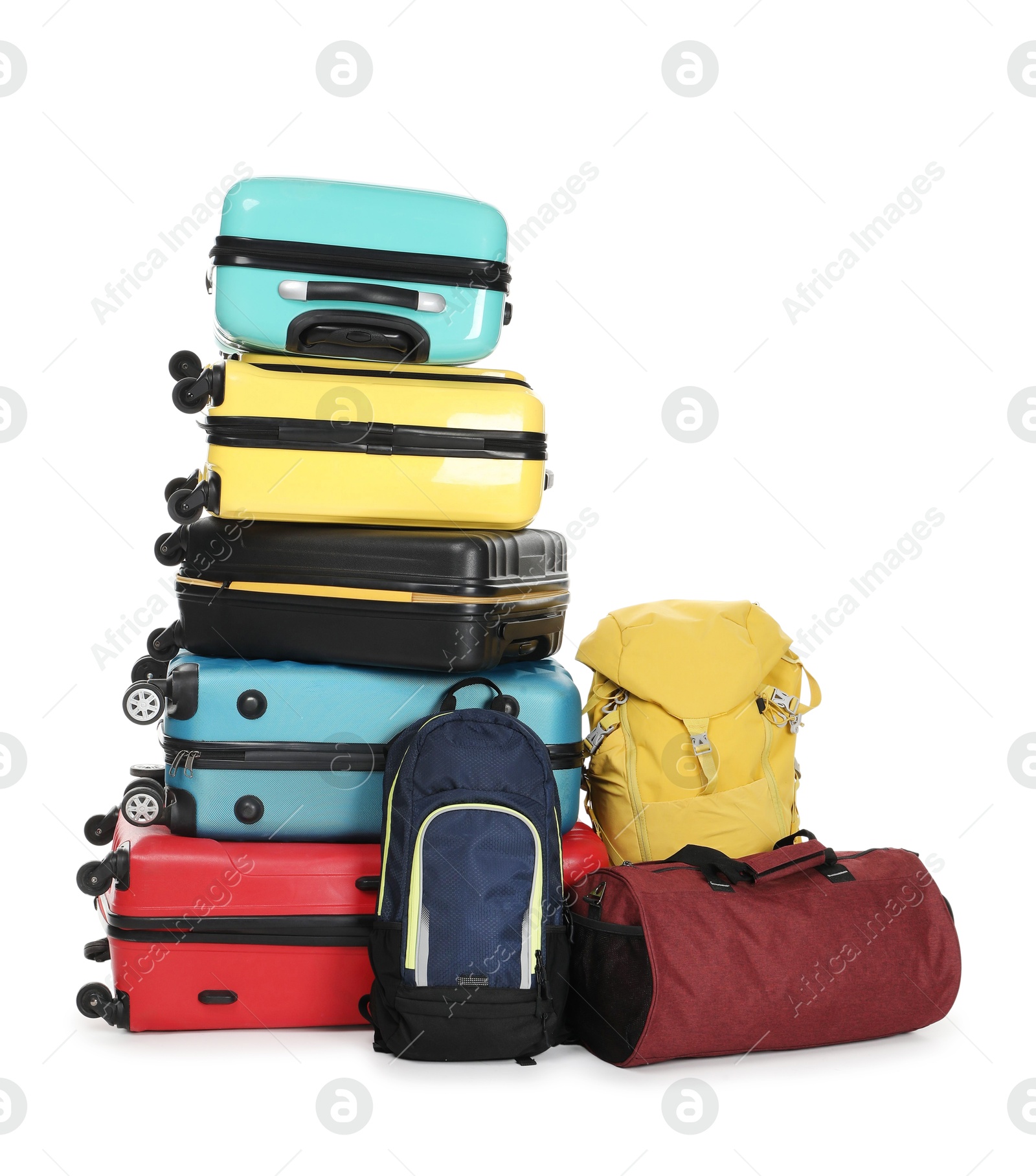 Photo of Stack of colorful suitcases, backpacks and bag isolated on white