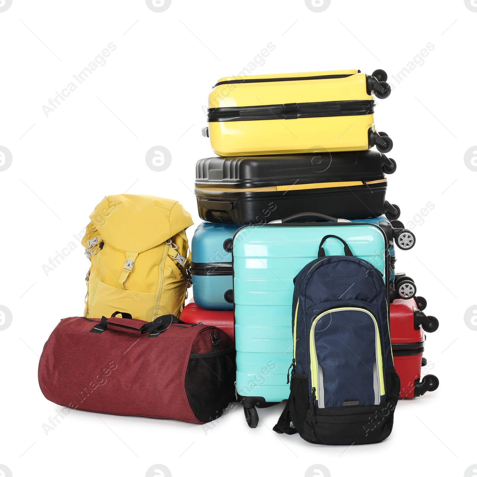 Photo of Stack of colorful suitcases, backpacks and bag isolated on white