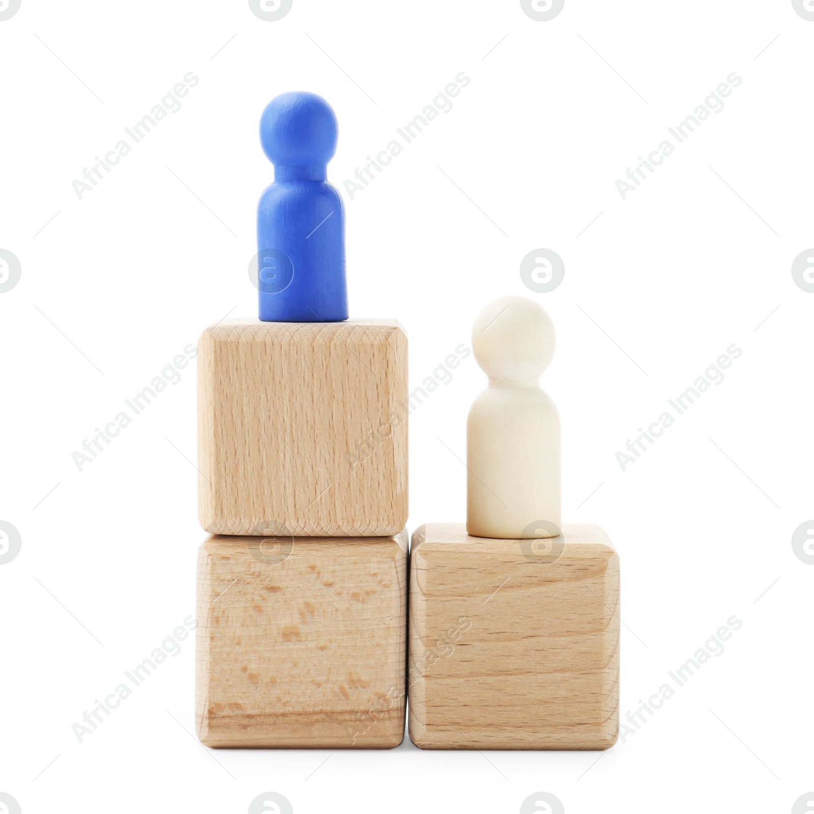 Photo of Human figures on wooden blocks, blue one on top against white background. Competition concept