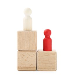 Photo of Human figures on wooden blocks against white background. Competition concept