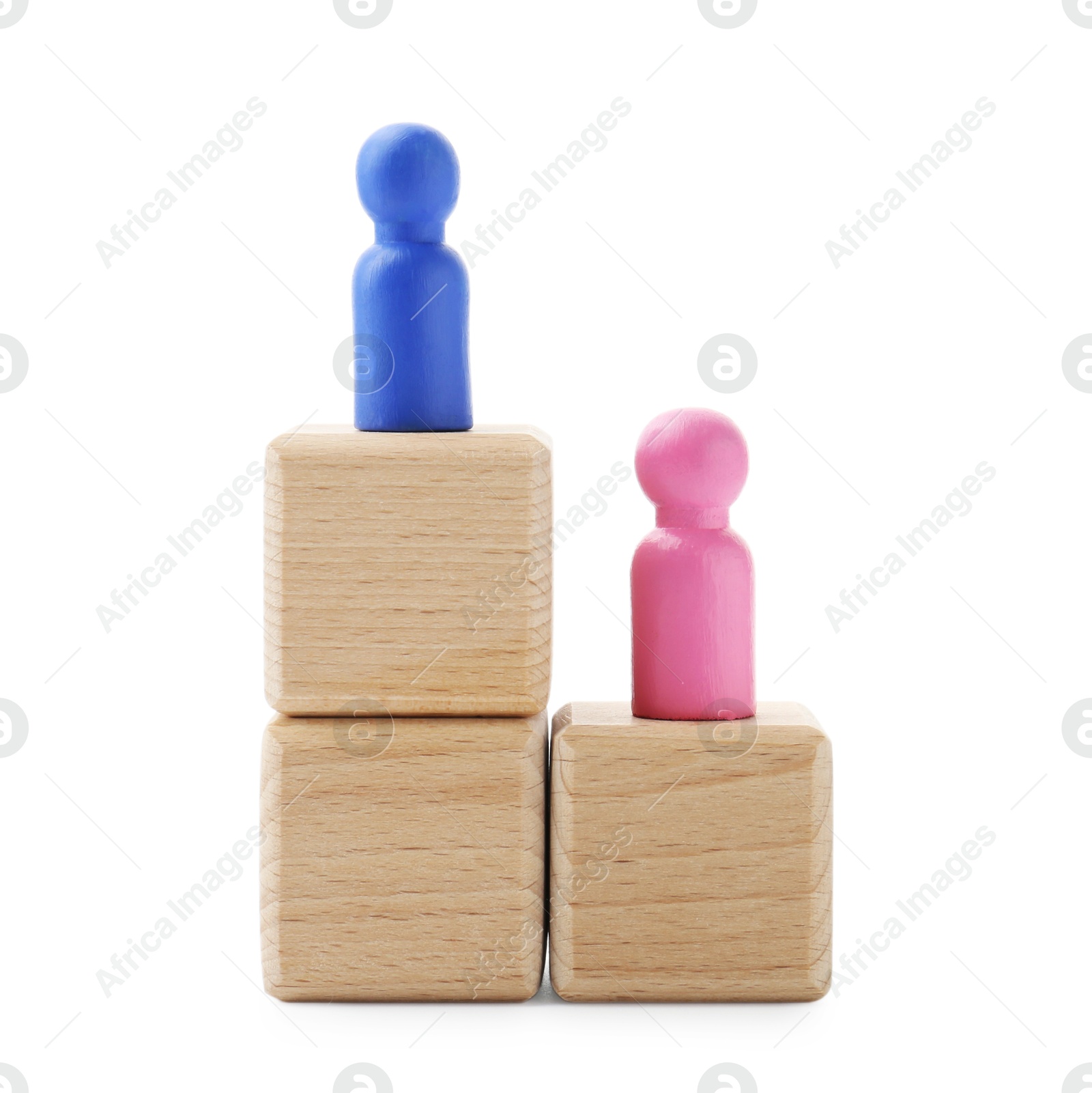 Photo of Human figures on wooden blocks, blue one on top against white background. Competition concept