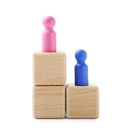 Human figures on wooden blocks, pink one on top against white background. Competition concept