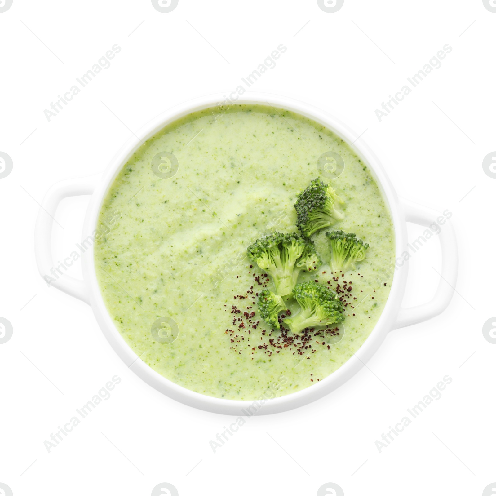 Photo of Delicious broccoli cream soup in bowl isolated on white, top view