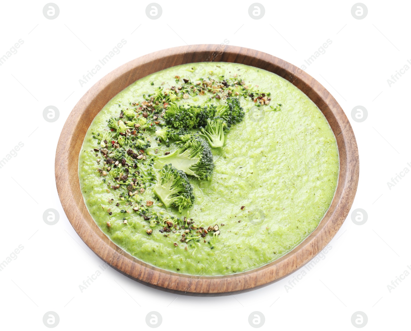 Photo of Delicious broccoli cream soup in bowl isolated on white