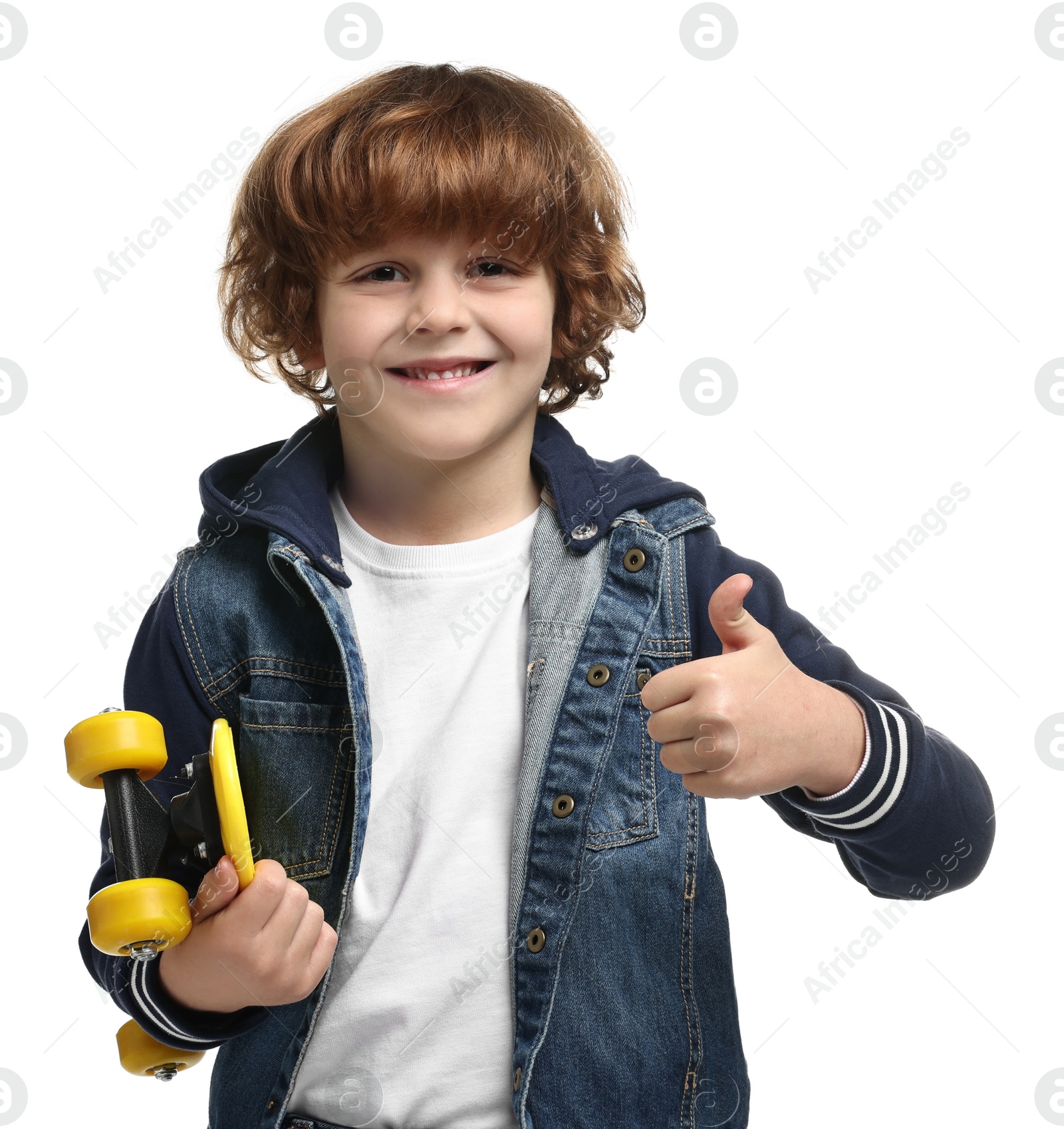 Photo of Little boy with penny board showing thumbs up on white background