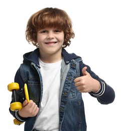 Photo of Little boy with penny board showing thumbs up on white background