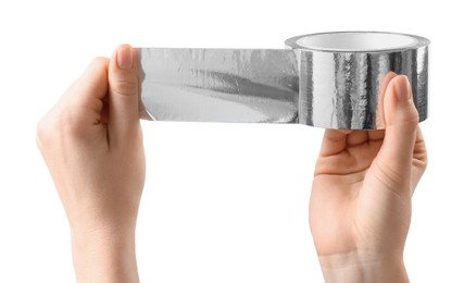 Woman with roll of silver adhesive tape on white background, closeup