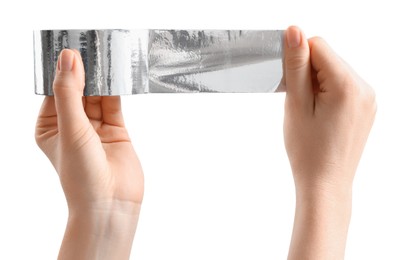 Woman with roll of silver adhesive tape on white background, closeup