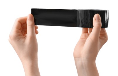 Photo of Woman with roll of black adhesive tape on white background, closeup