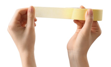 Woman with roll of masking tape on white background, closeup