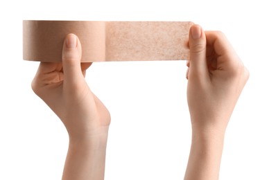 Woman with roll of masking tape on white background, closeup