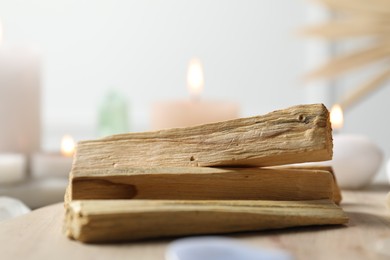 Photo of Palo santo wood sticks on table, closeup